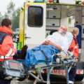 Injured man getting into ambulance